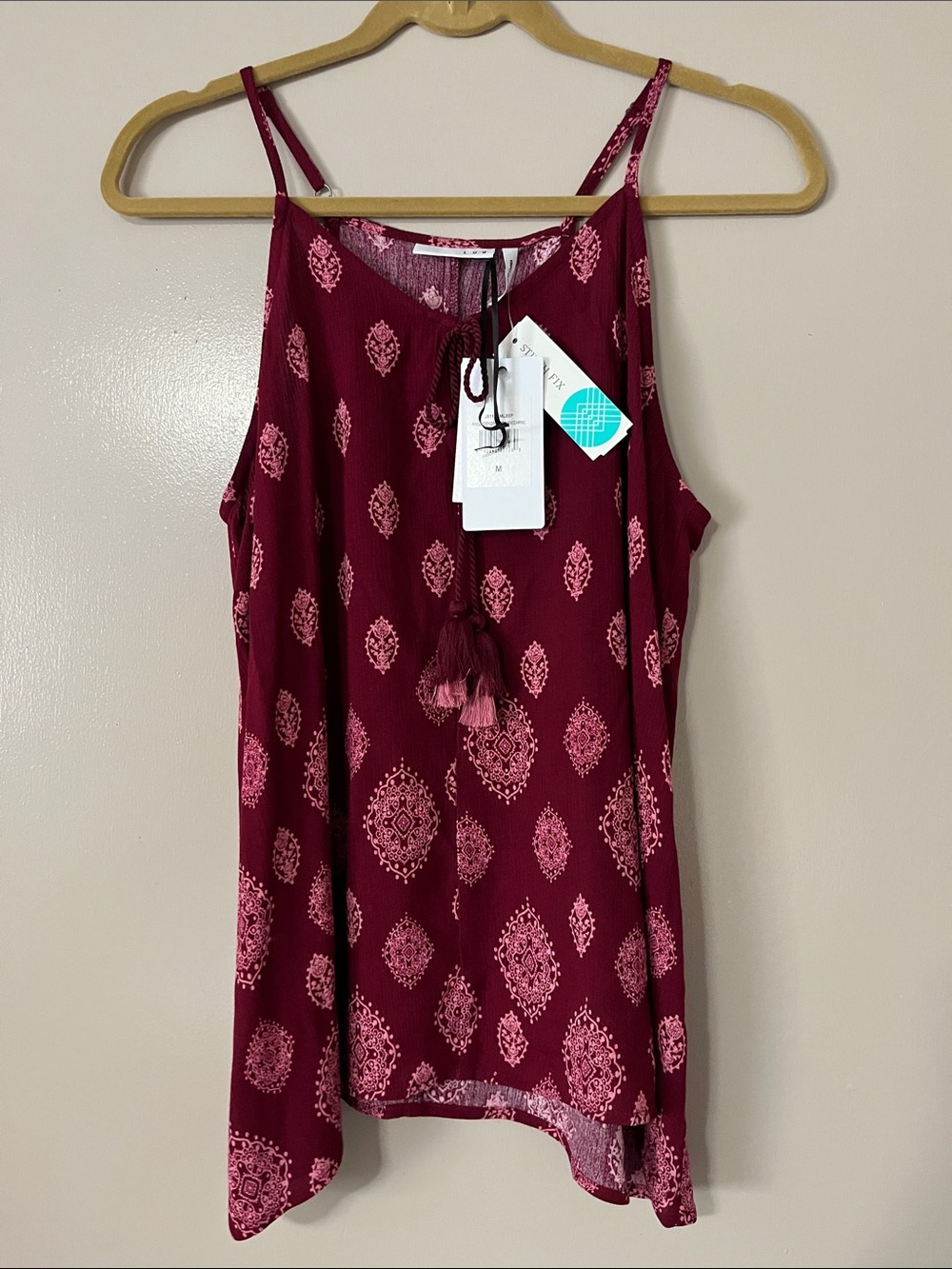 LUQ MEDIUM TANK TOP. NWT. Beautiful shade of cranberry, tassels, pink accents.